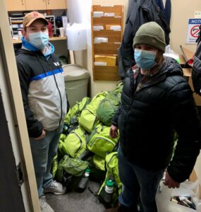 Chris and Sean with packed backpacks